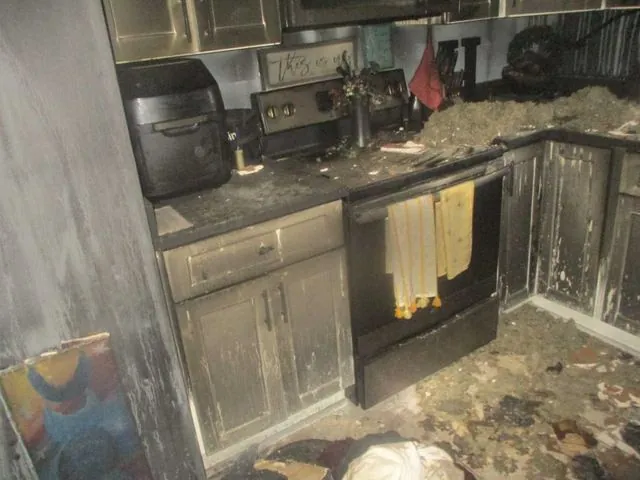 Kitchen before restoration, fire damage