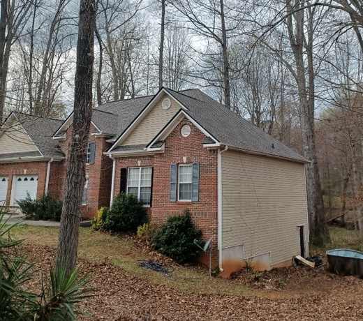 Roof after repair, new shingles installed